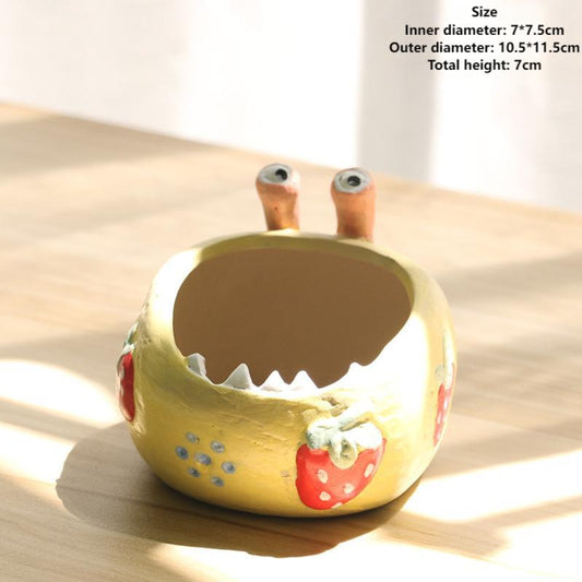 A large-eyed monster coarse clay hand-painted breathable succulent flowerpot