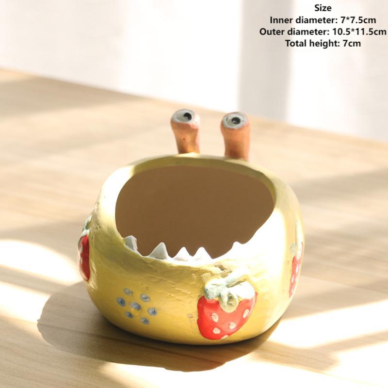 A large-eyed monster coarse clay hand-painted breathable succulent flowerpot